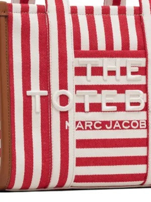 Close up of red bag, showing texture of the cotton fabric