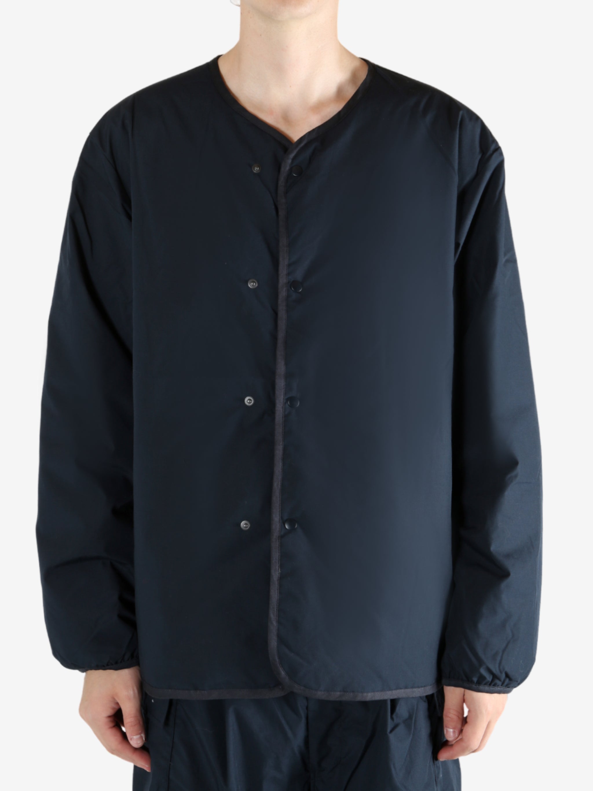 Navy cardigan worn by a person, showing the cardigan's fit