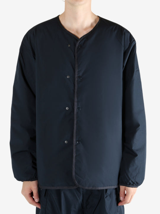 Navy cardigan worn by a person, showing the cardigan's fit