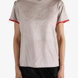 White t-shirt worn by a person, showing the shirt's fit