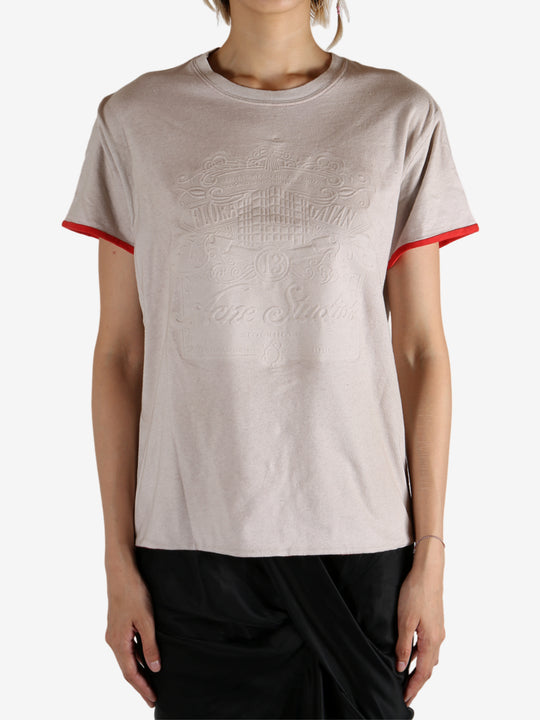 White t-shirt worn by a person, showing the shirt's fit