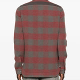 Red shirt worn by a person, showing the shirt's fit