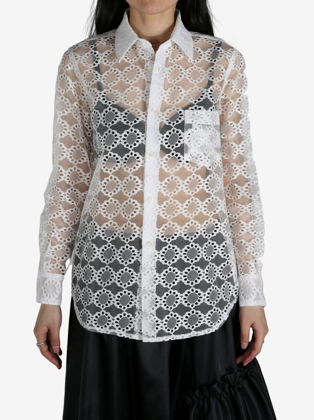 White tops worn by a person, showing the tops fit