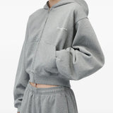 Grey hoodie worn by a person, showing the hoodie fit