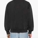 Black sweats worn by a person, showing the sweats' fit