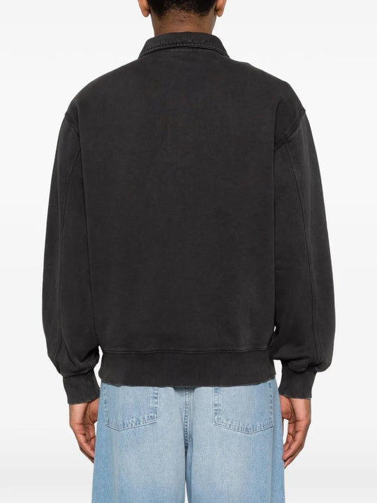 Black sweats worn by a person, showing the sweats' fit