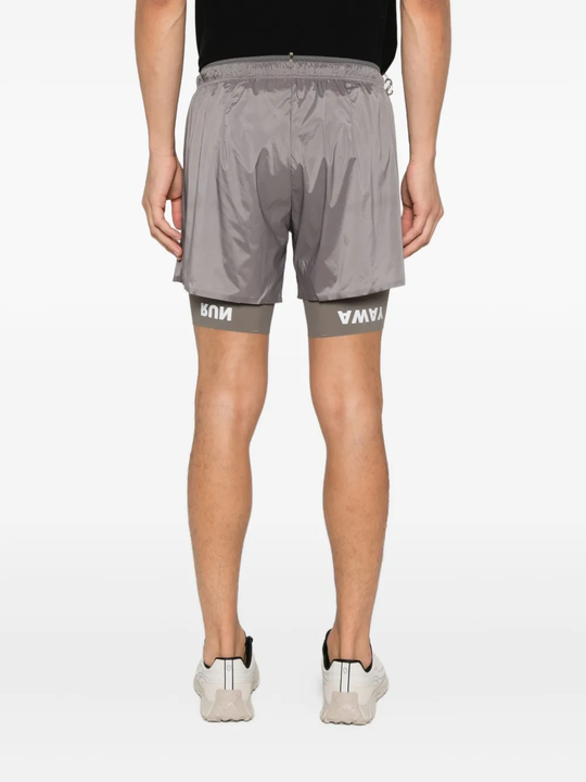 Gray shorts worn by a person, showing the shorts fit