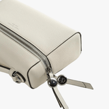 Close up of white bag, showing texture of the leather fabric