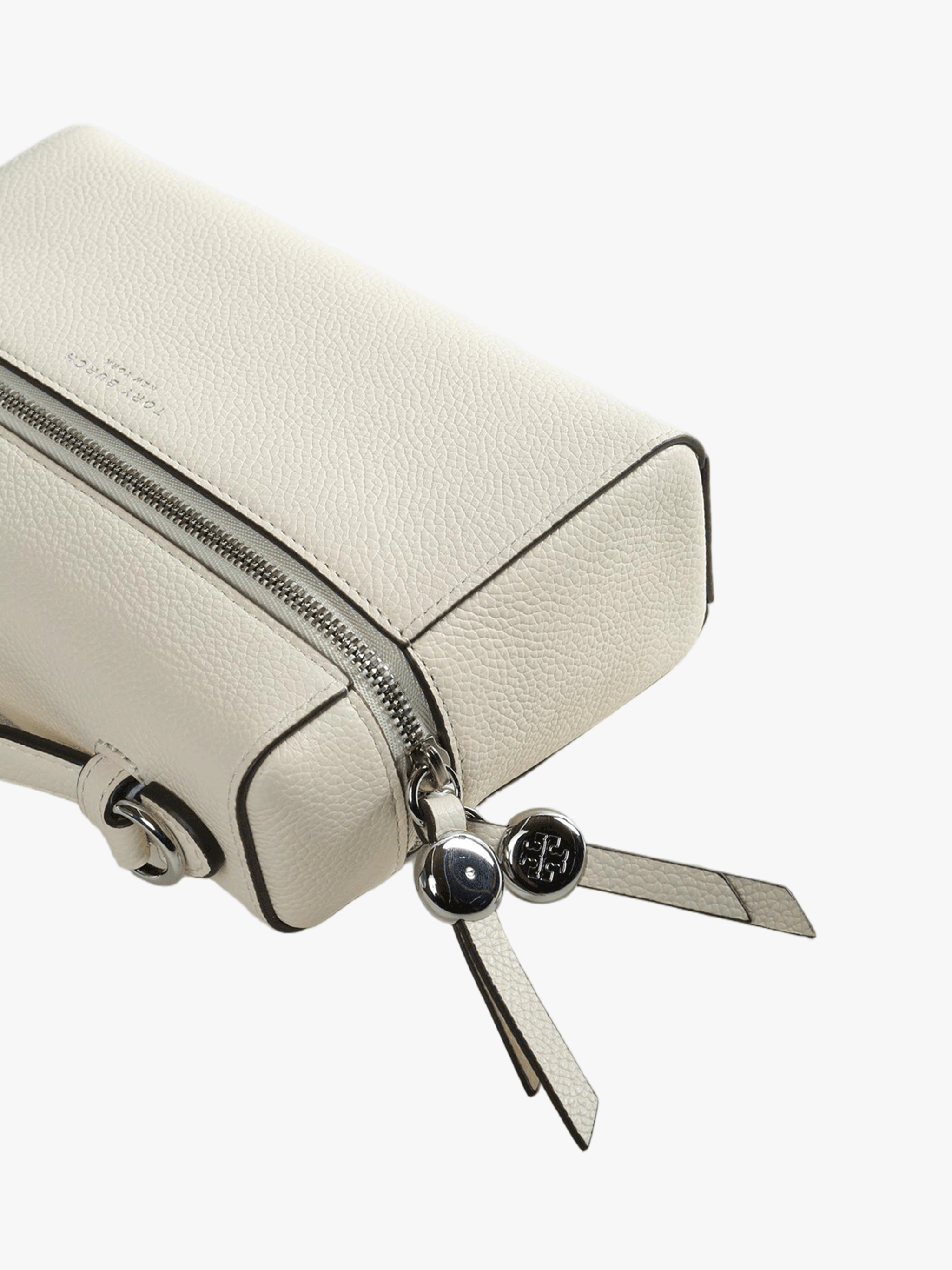 Close up of white bag, showing texture of the leather fabric
