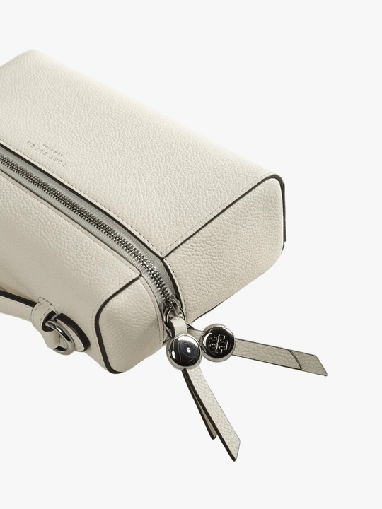Close up of white bag, showing texture of the leather fabric