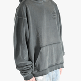 Grey hoodie worn by a person, showing the hoodie's fit