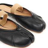 Close up of black shoes, showing texture of the calf leather fabric