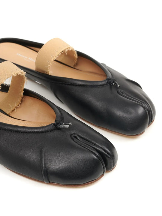 Close up of black shoes, showing texture of the calf leather fabric