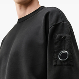 Black hoodie worn by a person, showing the hoodie fit