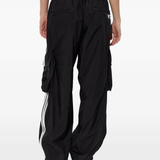 black pants worn by a person, showing the pants fit