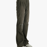 Brown pants worn by a person, showing the pants' fit