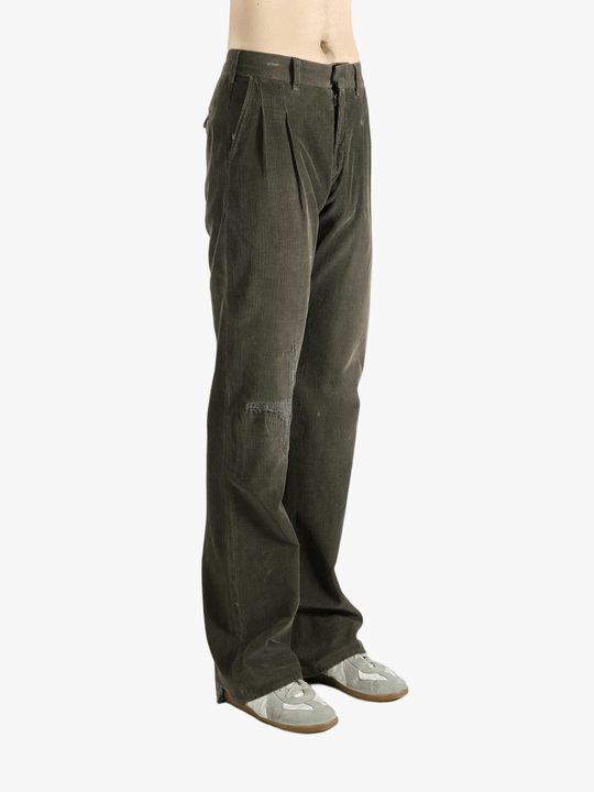 Brown pants worn by a person, showing the pants' fit