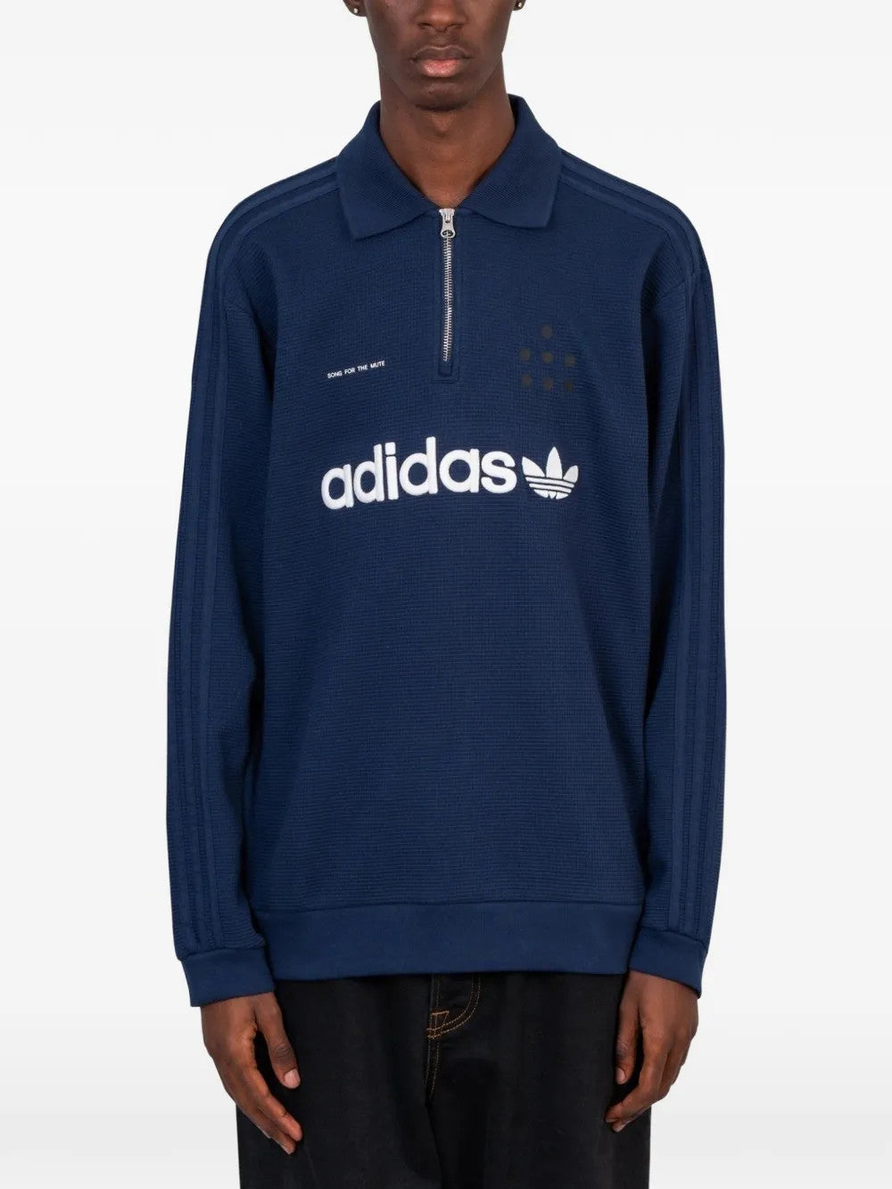 Navy shirt worn by a person, showing the shirt fit