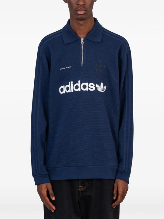 Navy shirt worn by a person, showing the shirt fit