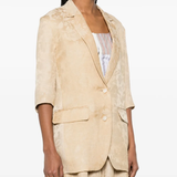 Tan jacket worn by a person, showing the jacket fit