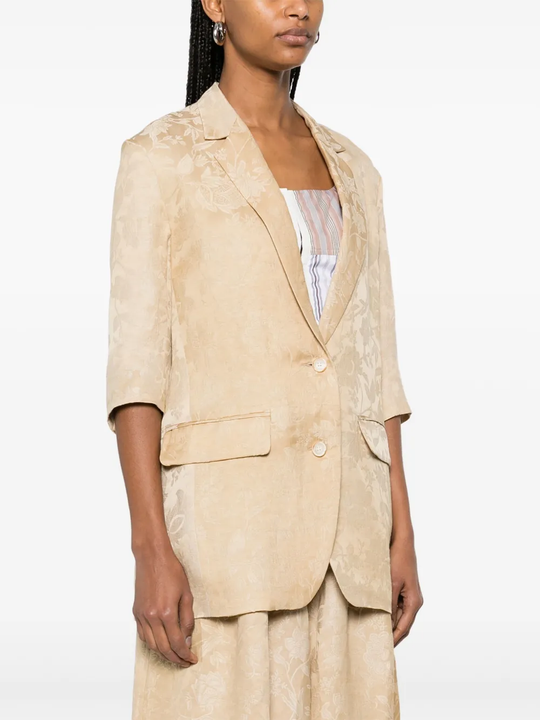 Tan jacket worn by a person, showing the jacket fit