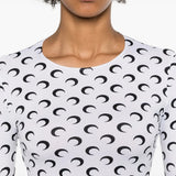 Close up of the white top, showing texture of the polyamide and elastane fabric