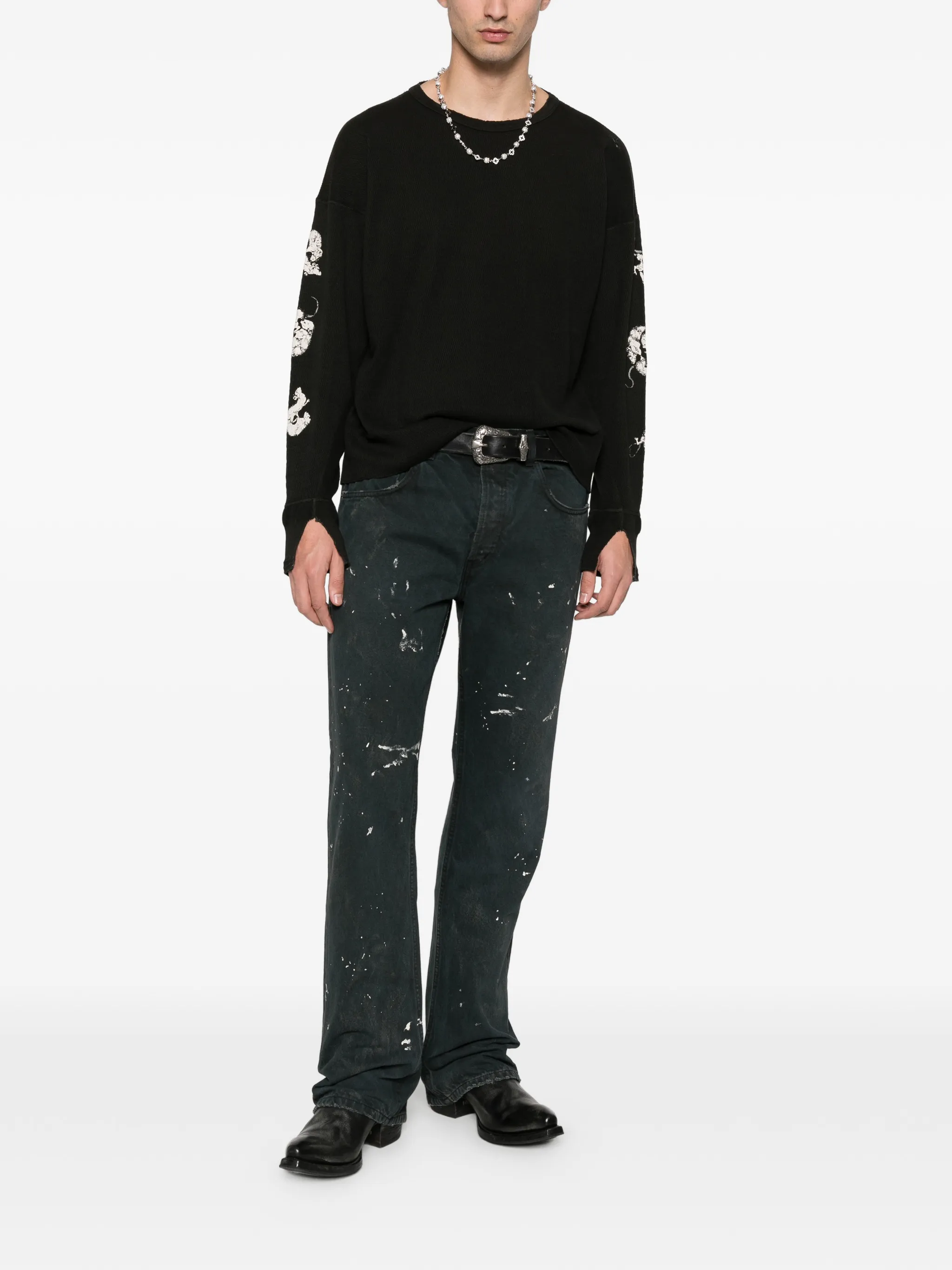 Black t-shirt worn by a person, showing the t-shirt's fit