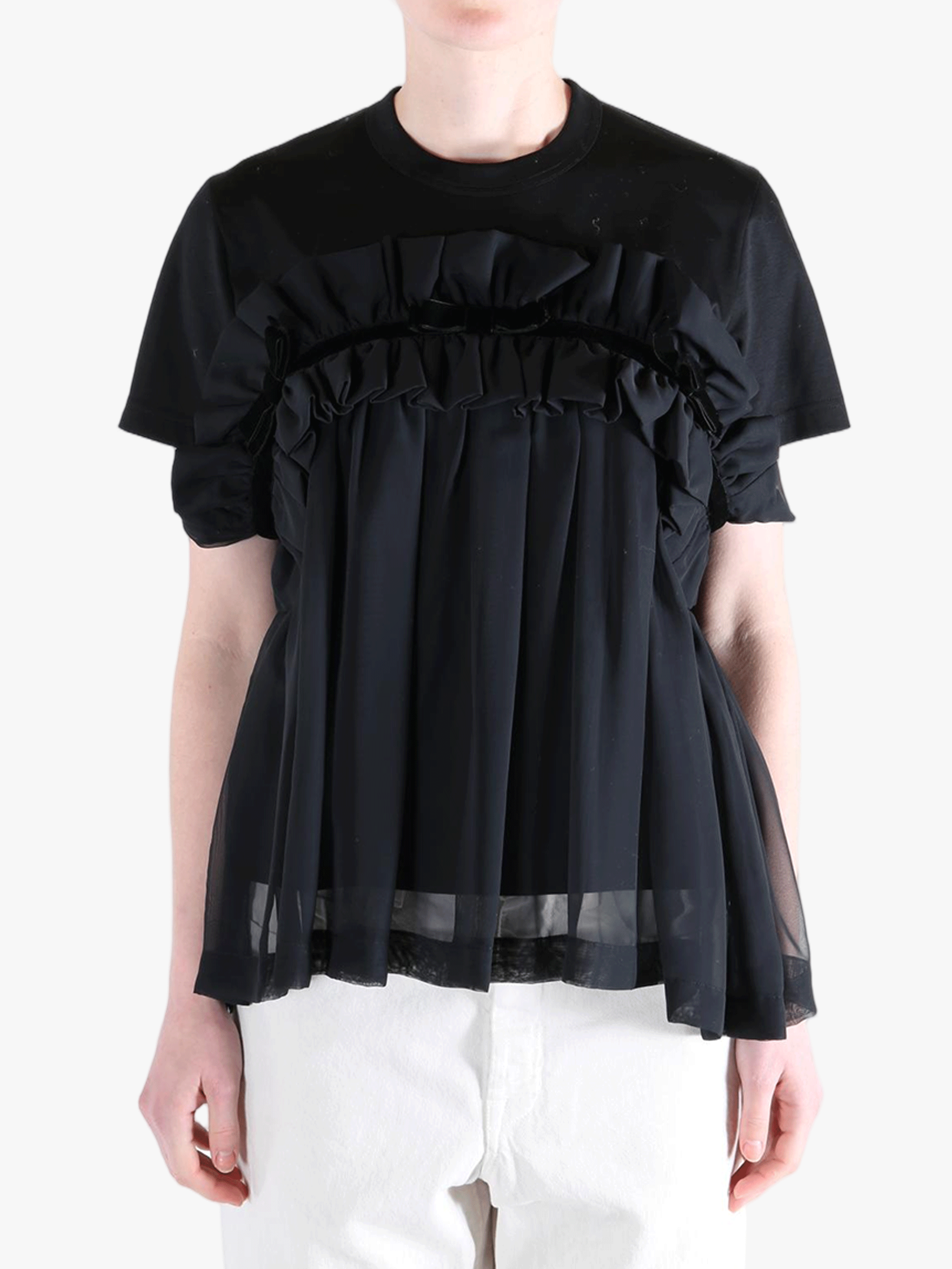 Black t-shirts worn by a person, showing the t-shirts fit