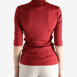 Red shirts worn by a person, showing the shirts fit