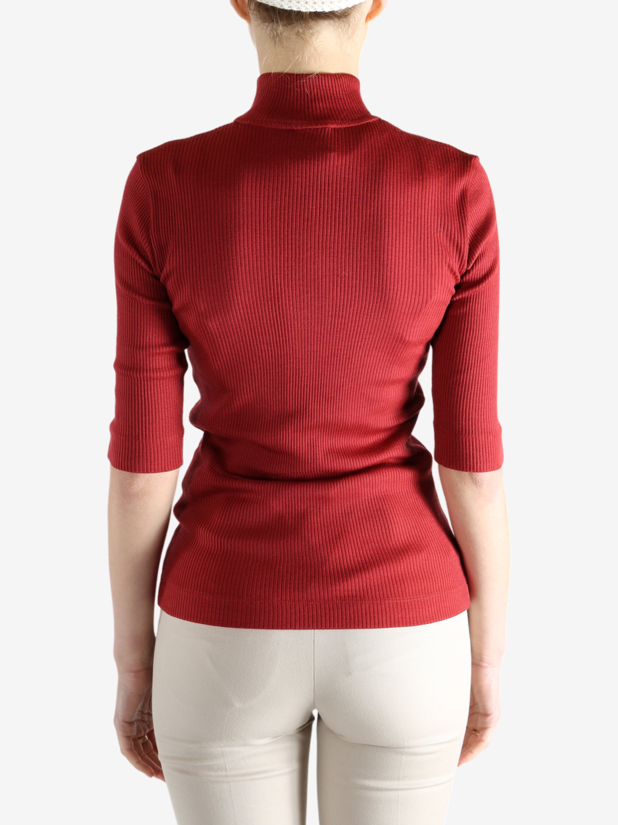 Red shirts worn by a person, showing the shirts fit