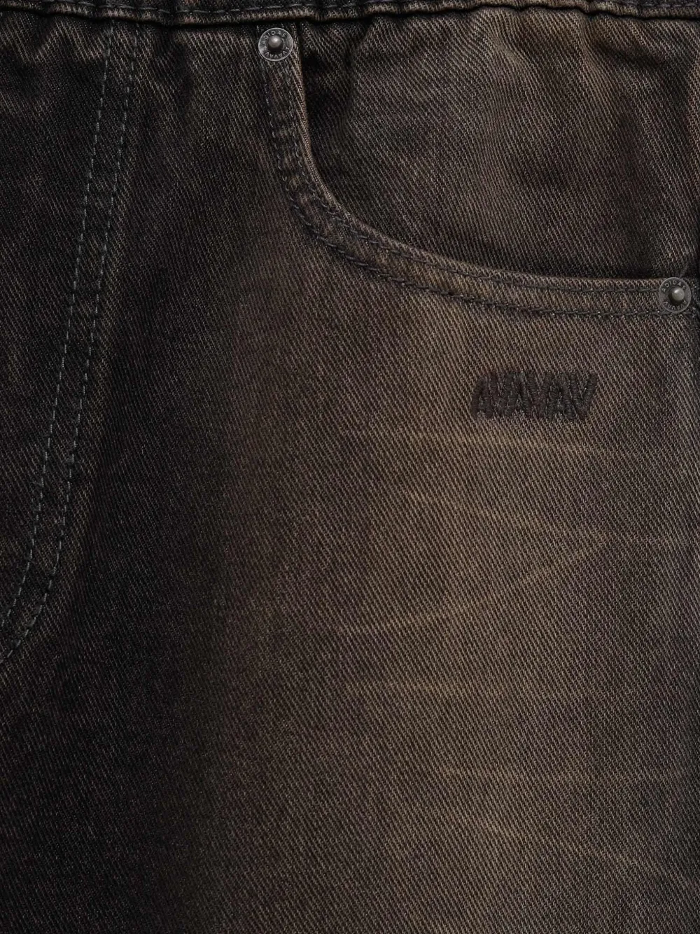 Close up of Black pants, showing texture of the cotton fabric