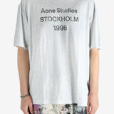 Grey t-shirt worn by a person, showing the shirt's fit