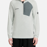 Grey hoodie worn by a person, showing the hoodie fit