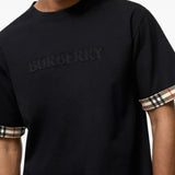 Black top worn by a person, showing the top fit