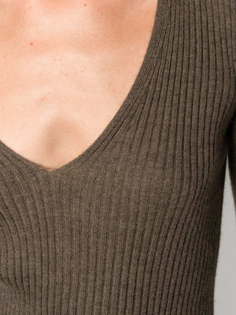 Close up of brown sweater, showing the material of cashmere and the V-neck
