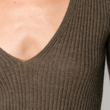 Close up of brown sweater, showing the material of cashmere and the V-neck