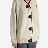 White knitwear worn by a person,showing the knitwear's fit