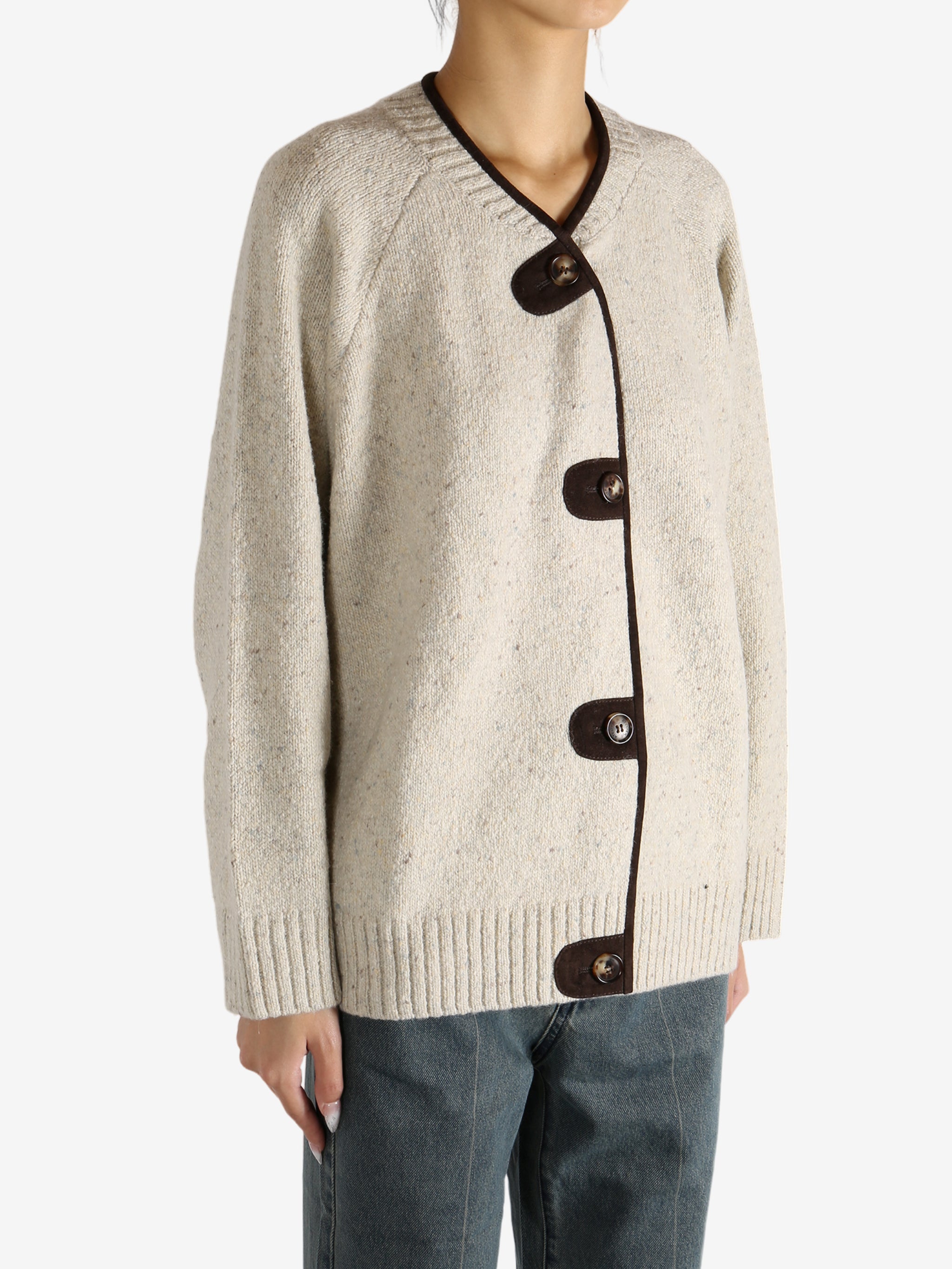 White knitwear worn by a person,showing the knitwear's fit