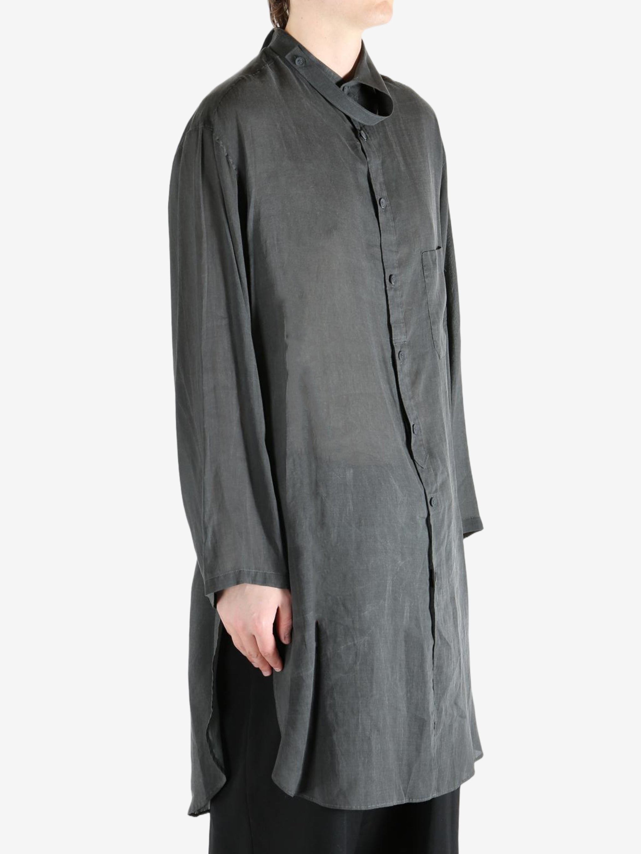 Black shirt,worn by a person, showing the shirt's fit