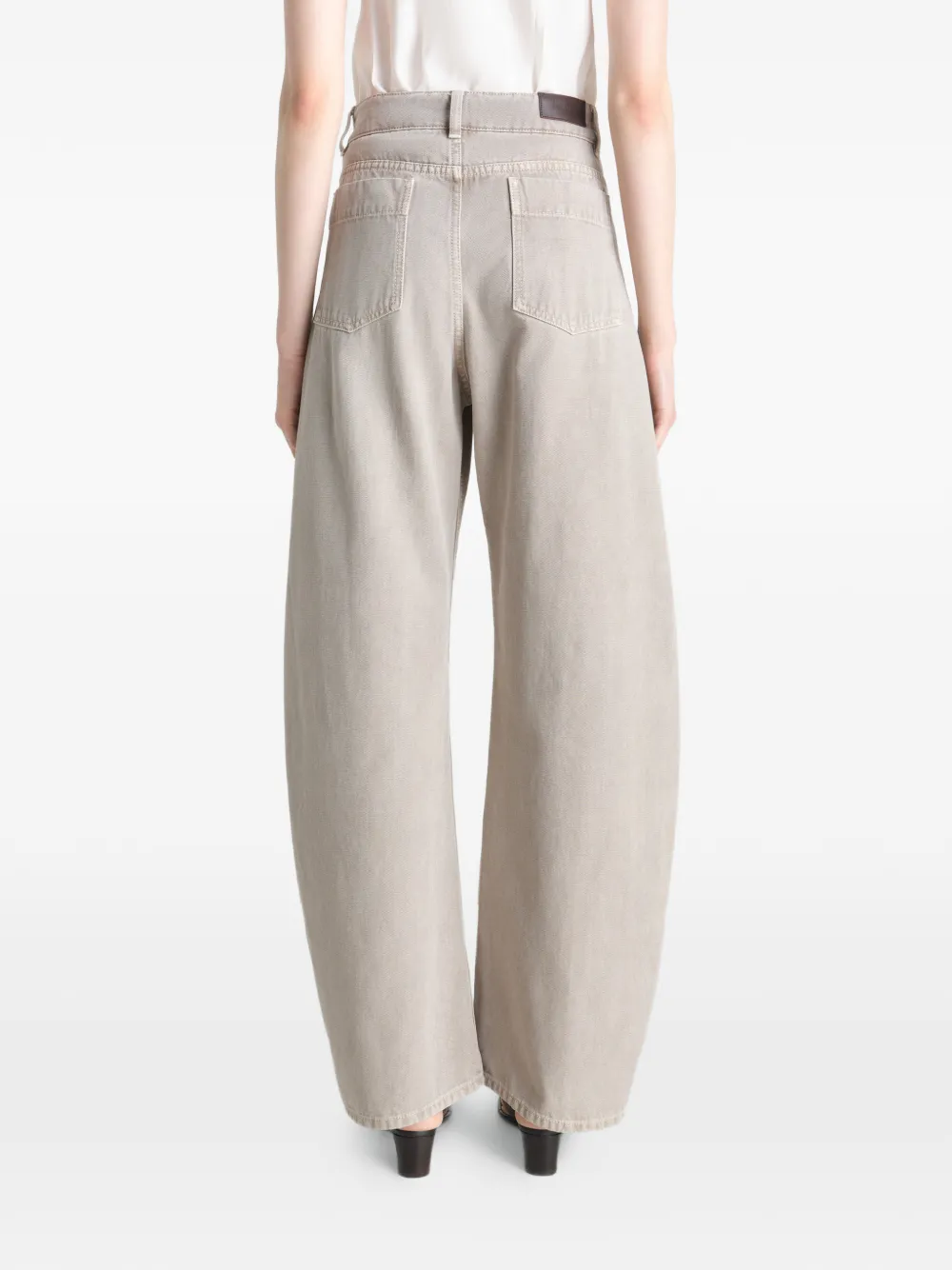 Grey pant worn by a person, showing the pant's fit