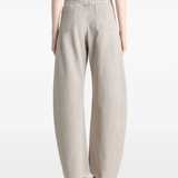 Grey pant worn by a person, showing the pant's fit
