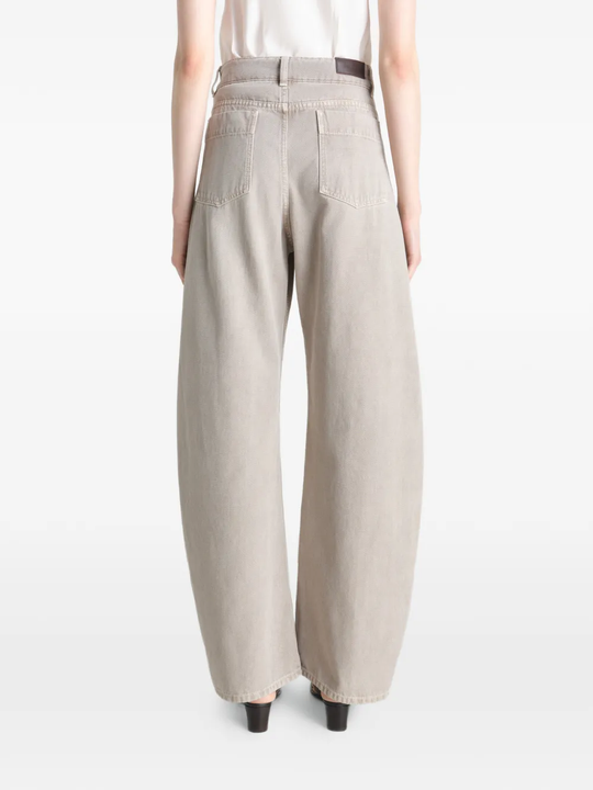 Grey pant worn by a person, showing the pant's fit