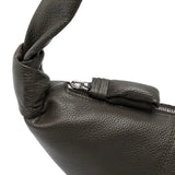 Close up of the grey bag, showing texture of the leather fabric