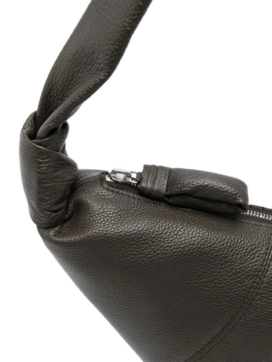 Close up of the grey bag, showing texture of the leather fabric
