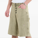 Green shorts worn by a person, showing the shorts fit