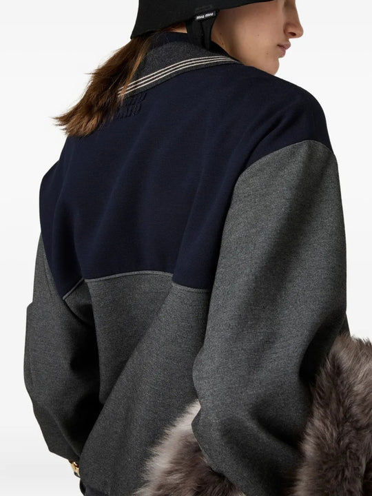 Close up of the grey sweatshirt, showing texture of the viscose fabric