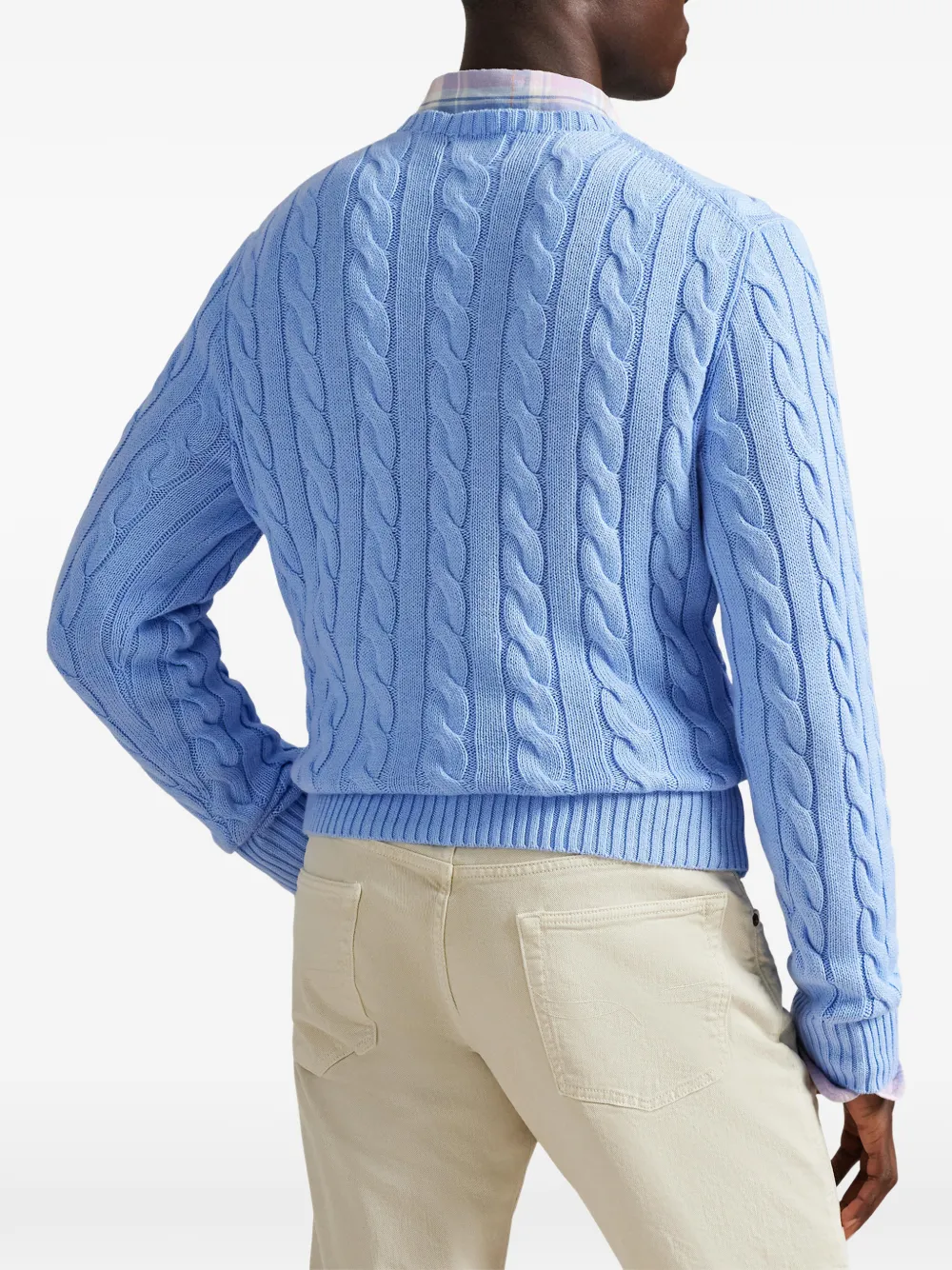 Blue sweater worn by a person, showing the sweater fit