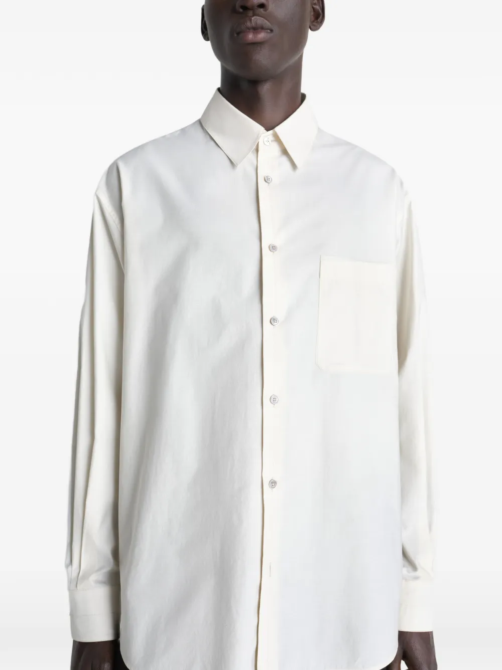 white shirts worn by a person, showing the shirts fit