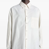 white shirts worn by a person, showing the shirts fit
