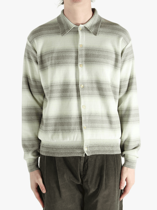 Green sweater worn by a person, showing the sweater's fit